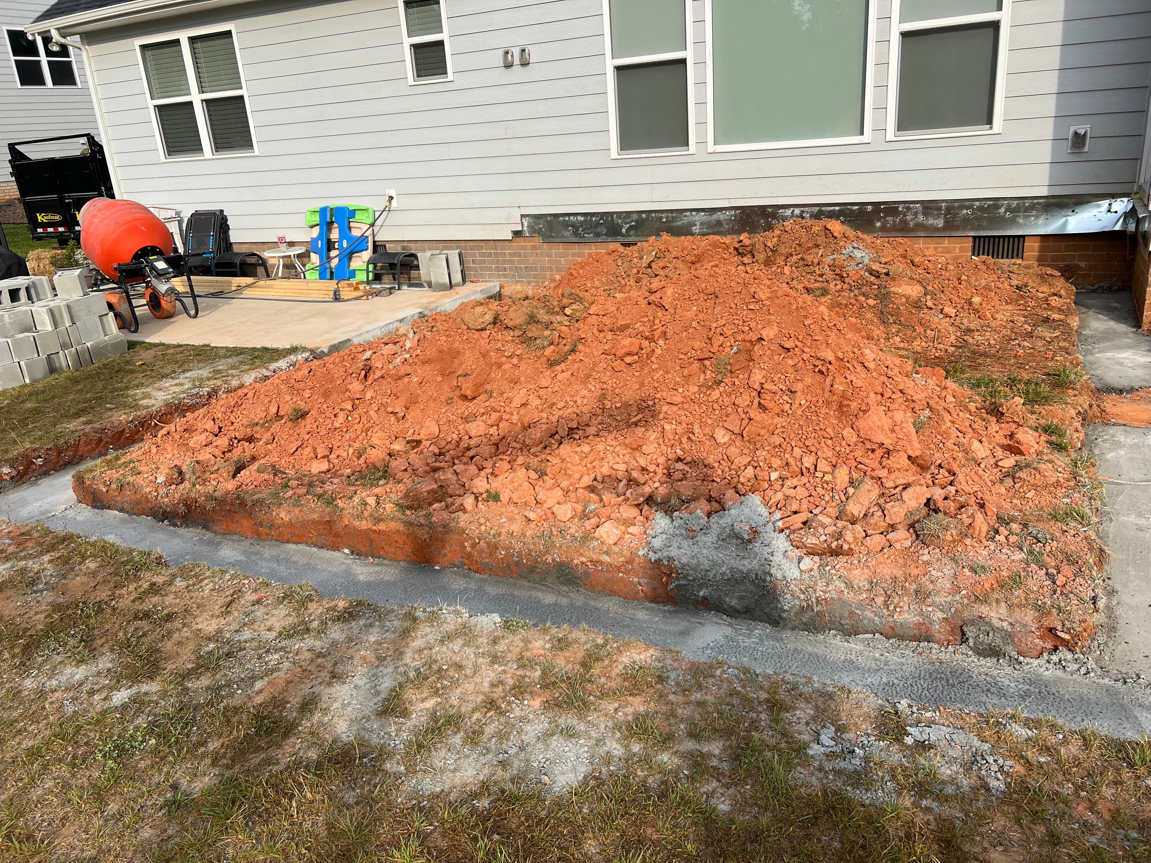 Excavation and foundation preparation for a home addition