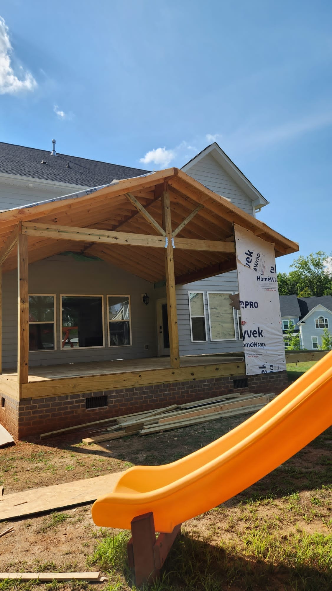 Covered porch addition during framing and exterior work